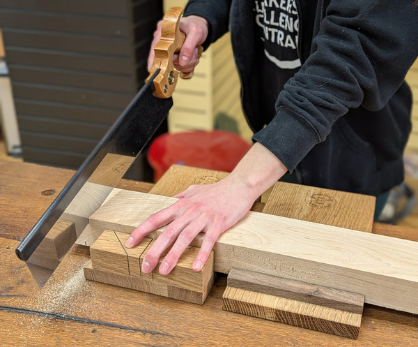 Bad axe bench hook set being used with a backsaw