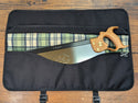 A tenon saw inside of our black saw tool bag